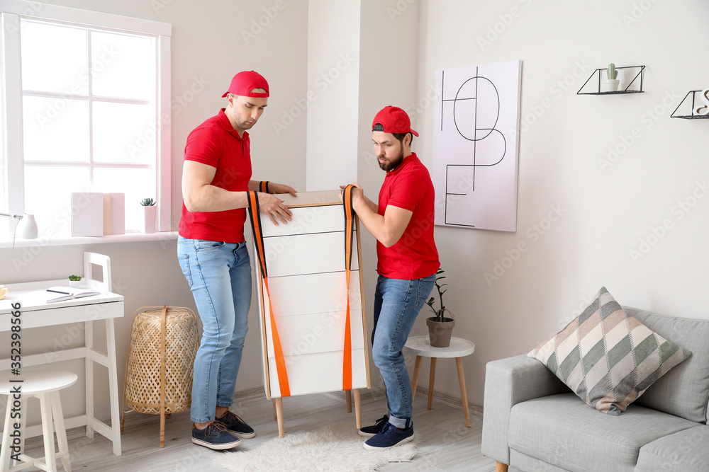 Loaders carrying furniture by using cargo belts