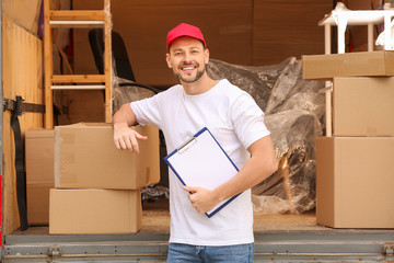 Wall Mural - Loader near truck with freight