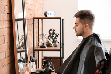 Wall Mural - Handsome young man in hairdressing salon