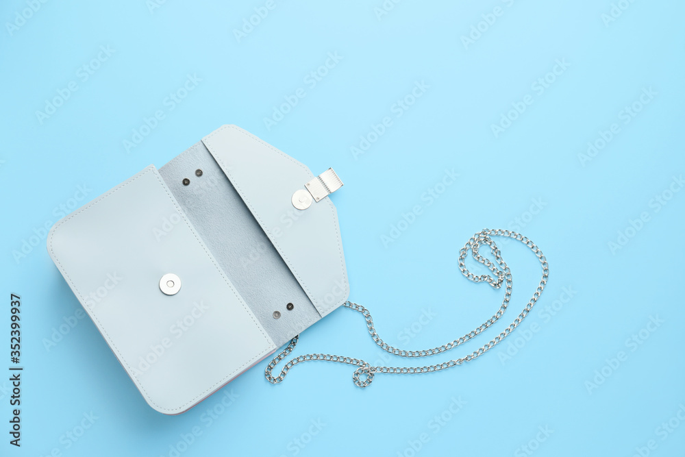 Stylish bag on color background