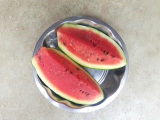 watermelon with slices on white background. Red of Slice watermelon on the plate, Summer concept. closeup of some pieces of refreshing watermelon on a white background. A fruits of summer season. 
