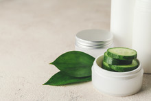 Cosmetics With Cucumber Extract On Table