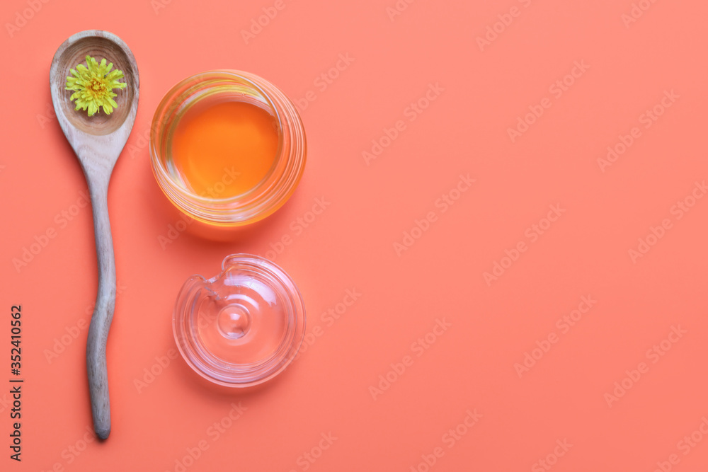 Composition with sweet dandelion honey on color background