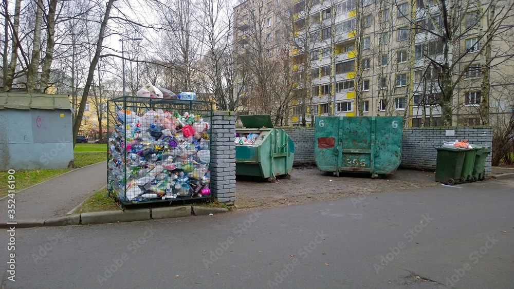 Trash container and rubbish near residential building. Old dumpsters ...