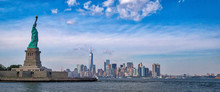 Panorama Of The Statue Of Liberty With The One World Trade Building Center Over Hudson River And New York Cityscape Background.