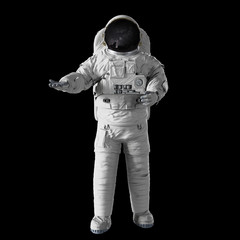 Wall Mural - astronaut presenting an empty space isolated on black background