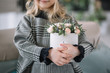 © Татевик Багдасарян - A little girl holds flowers in her hands, a beautiful flower arrangement in a box, a child prepared a gift for mom. Happy mothers day