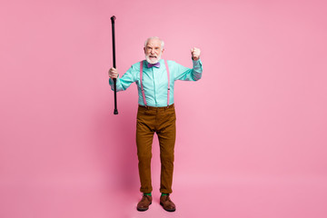 Sticker - Full length photo of mad aged man raise walking cane angry grimace blaming neighbor kids for noisy behavior wear shirt suspenders bow tie trousers shoes isolated pink pastel background