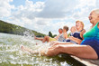 © Robert Kneschke - Vital seniors splashing in the lake