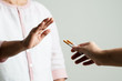 Quit smoking, no tobacco day, mother hands gesture reject proposal the cigarette, selective focus