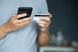© Pixelated 275 - using smartphone and credit card online shopping