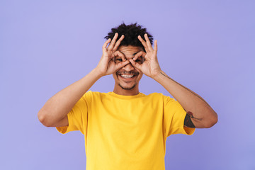 Canvas Print - Photo of cheerful african american man showing ok sign and smiling