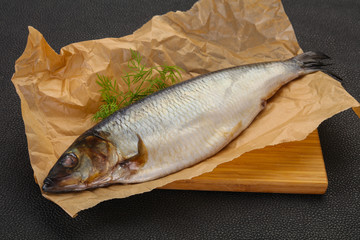 Salted herring over the wooden board