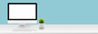 canvas print picture - Mockup desktop computer display blank screen on desk in office, workspace with mock up computer screen empty, plant and copy space on table in home, business presentation concept, banner website.