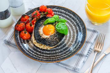 Canvas Print - Baked egg and mushroom brunch with baby tomatoes