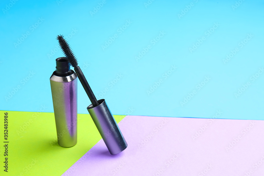 Black mascara on color background