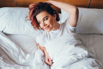 Wall Mural - beautiful girl relaxing in bed in morning during self isolation