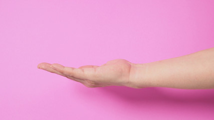 Wall Mural - empty hand on pink background.