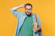 © ViDi Studio - Preoccupied young man student in casual clothes glasses with backpack hold books isolated on yellow background. Education in high school university college concept. Put hand on head, looking aside.