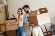 © BalanceFormCreative - Young married couple moving into new home.