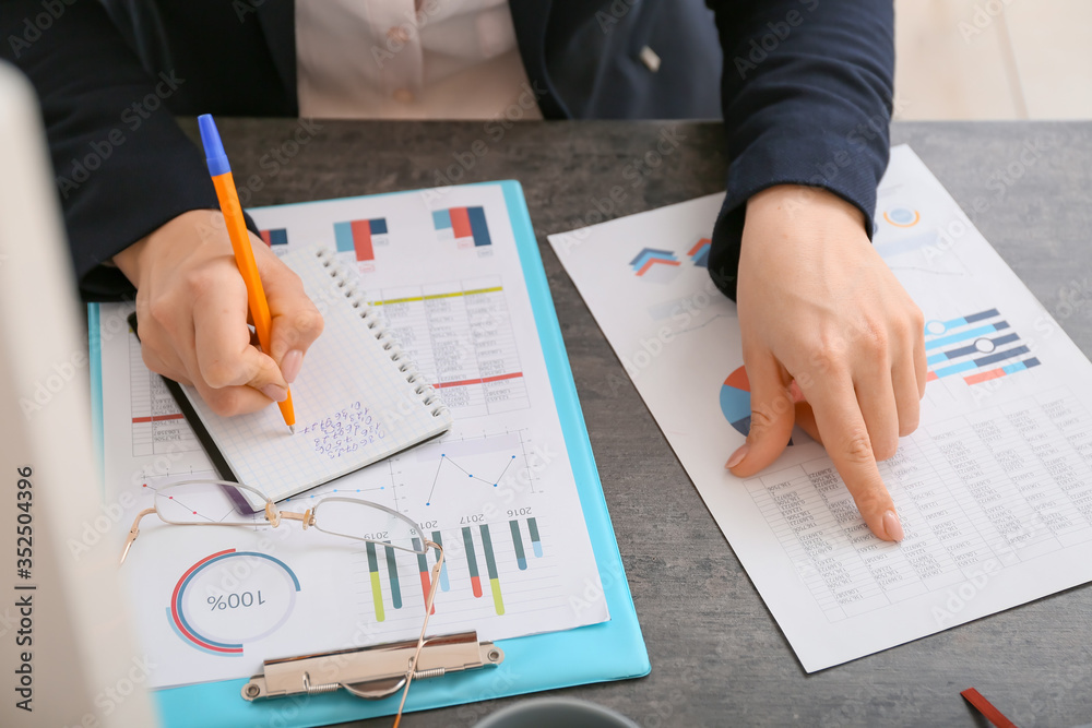 Female accountant working in office, closeup