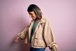 © Krakenimages.com - Young beautiful woman wearing fashion urban clothes, model wearing casual street style standing over pink background