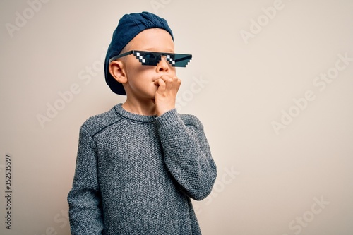 Young Little Caucasian Kid Wearing Internet Meme Thug Life Glasses Over Isolated Background Looking Stressed And Nervous With Hands On Mouth Biting Nails Anxiety Problem Buy This Stock Photo And Explore