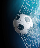 Fototapeta Sport - soccer ball in goal with spotlight