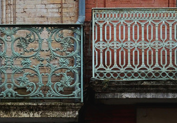 Detail of facade with beautiful smelting handrails in balconies. City of Toulouse. France. 