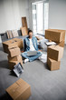 © Yakobchuk Olena - Happy man with laptop enjoying being in new apartment