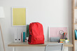 school backpack and stationery in a bright room. Preparing for school. Back to school. Place for text. National School Backpack Awareness Day