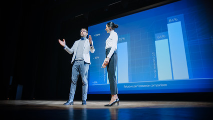 Aufkleber - On Stage, Successful Female CEO and Male COO Speakers Present Company's New Product, Show Infographics, Statistics on Big Screen, Talk About Growth. Live Event, Tech Startup, Business Conference