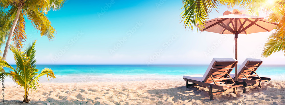 Deckchairs  And Parasol With Palm Trees In The Tropical Beach
 - obrazy, fototapety, plakaty 