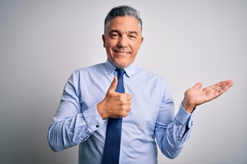 Sticker - Middle age handsome grey-haired business man wearing elegant shirt and tie Showing palm hand and doing ok gesture with thumbs up, smiling happy and cheerful