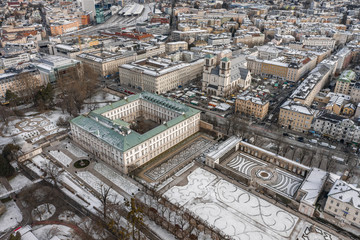 Aerial drone shot view of Mirabell Palace in Salzburg coverd with snow in winter time