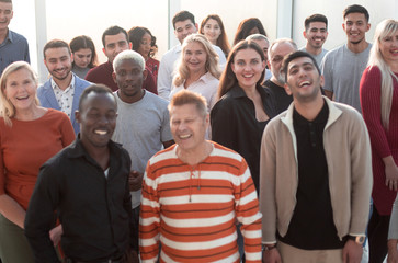 Wall Mural - Happy confident business team stands in office