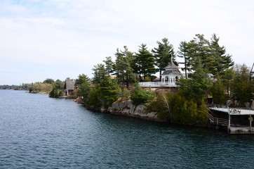 Wall Mural - One Island in Thousand Islands Region in fall of New York State, USA