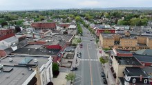 Rising Aerial Pullback Revealing Shot Of Main Street In Small American Historic Town In Pennsylvania, Anytown USA