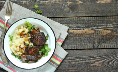 Poster - baked short ribs with mashed potatoes.
long stewed meat. rustic style, wooden table, top view, copy space