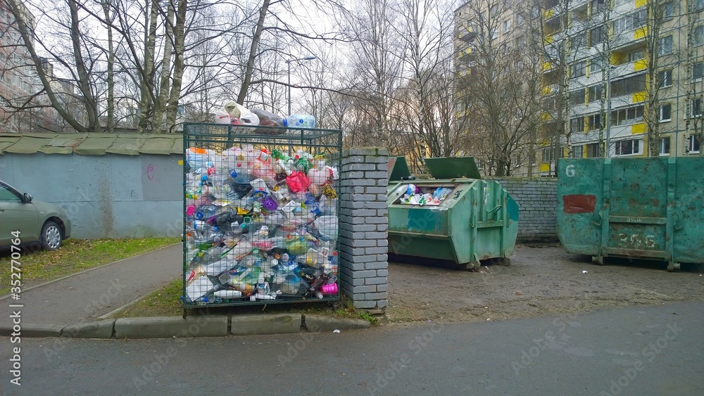 Trash container and rubbish near residential building. Old dumpsters ...