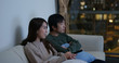 © leungchopan - Couple watch tv together at home in the evening