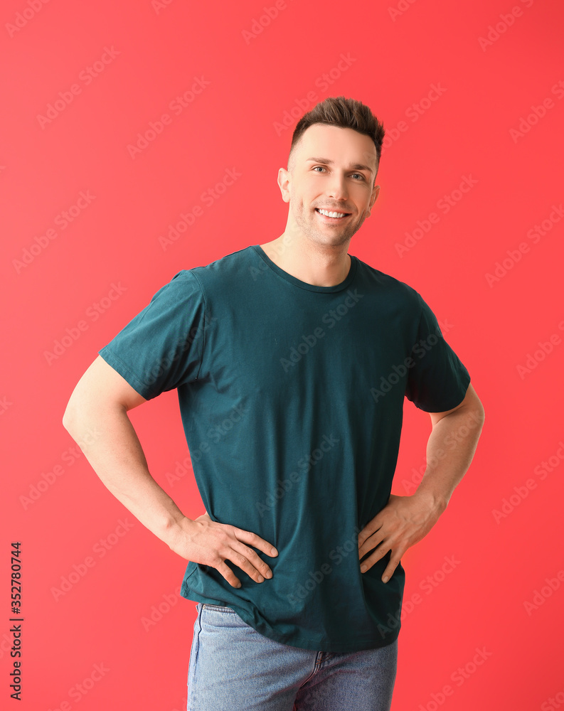 Man in stylish t-shirt on color background