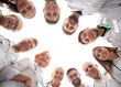 © ASDF - close up. group of doctors standing in a circle and looking at you