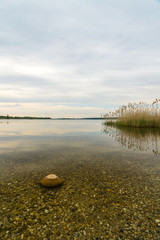 Wall Mural - Stony sunset beach at the Markkleeberger Lake near Leipzig 