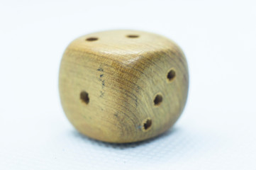 Wooden dice with numbers close up. Macro photography