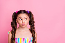 Photo Of Beautiful Pretty Funny Little Lady Two Cute Curly Tails Look Interested Side Empty Space Send Air Kisses Shy Girl Wear Colored Dress Summer Singlet Isolated Pink Color Background