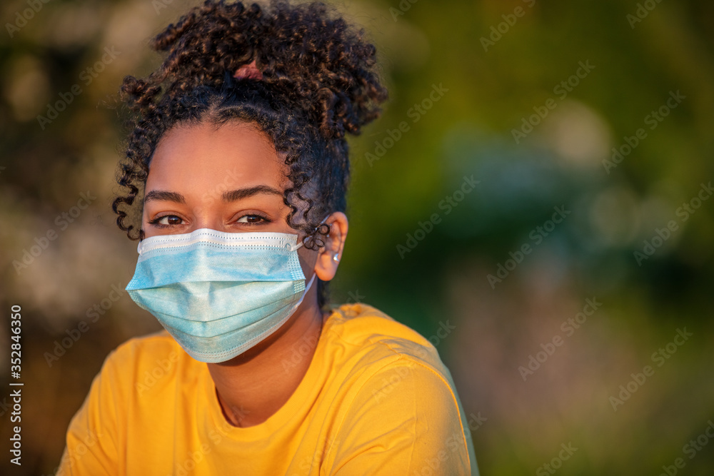 African American Teenager Girl Woman Wearing Coronavirus COVID-19 Face Mask in Virus Pandemic - obrazy, fototapety, plakaty 