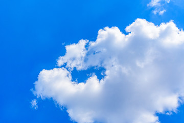 White fluffy clouds in the blue sky