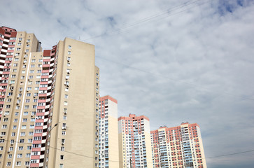 Modern East European residential apartment buildings quarter on a sunny day with a blue sky.Abstract architecture, fragment of modern urban geometry