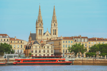 Wall Mural - View of Saint-Louis Church in Chartrons district from the other side of Garonne River, Bordeaux, France